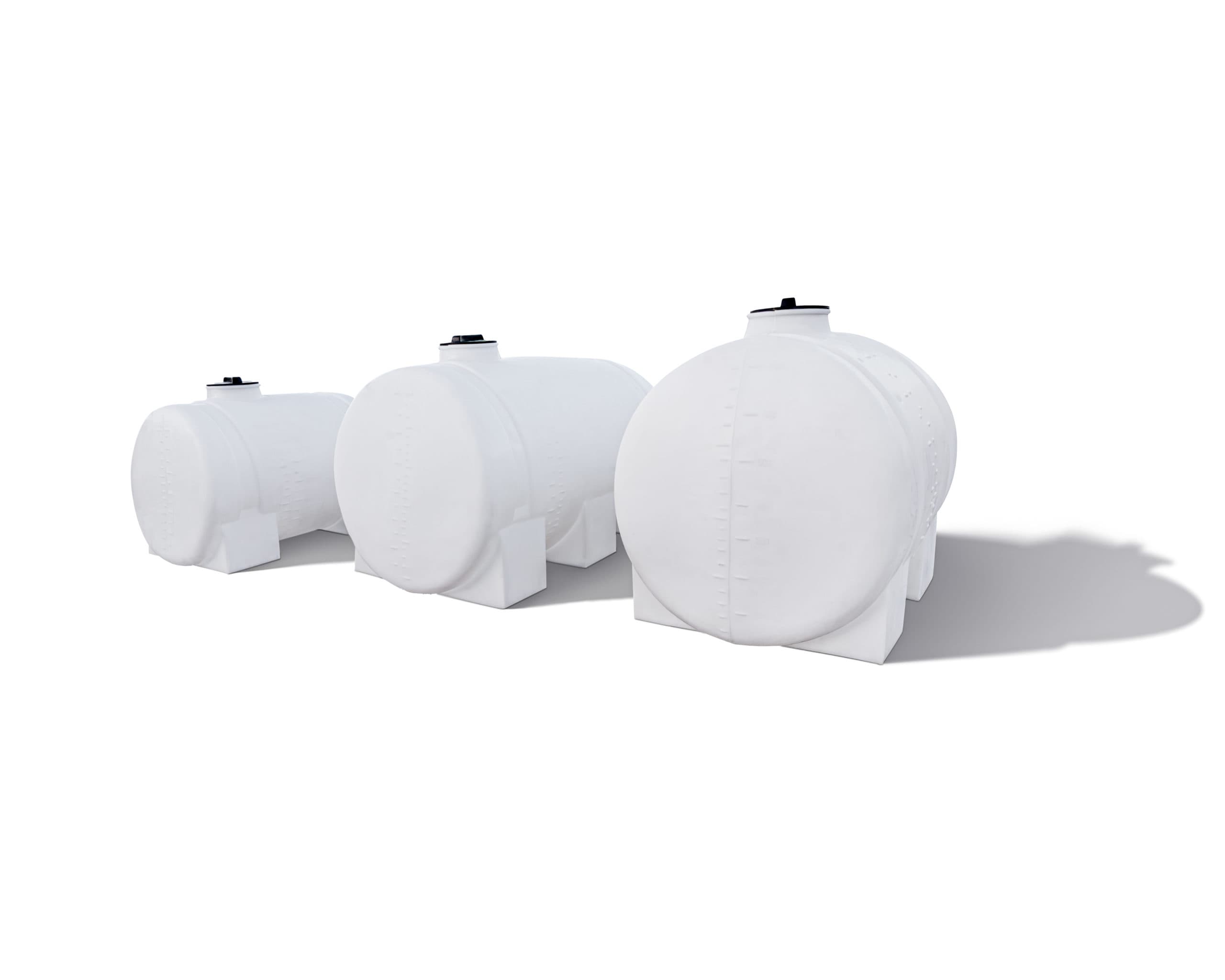 Three white horizontal polyethylene storage tanks