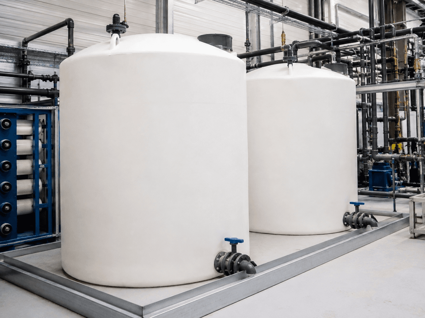 Large polyethylene tanks installed in an industrial process system