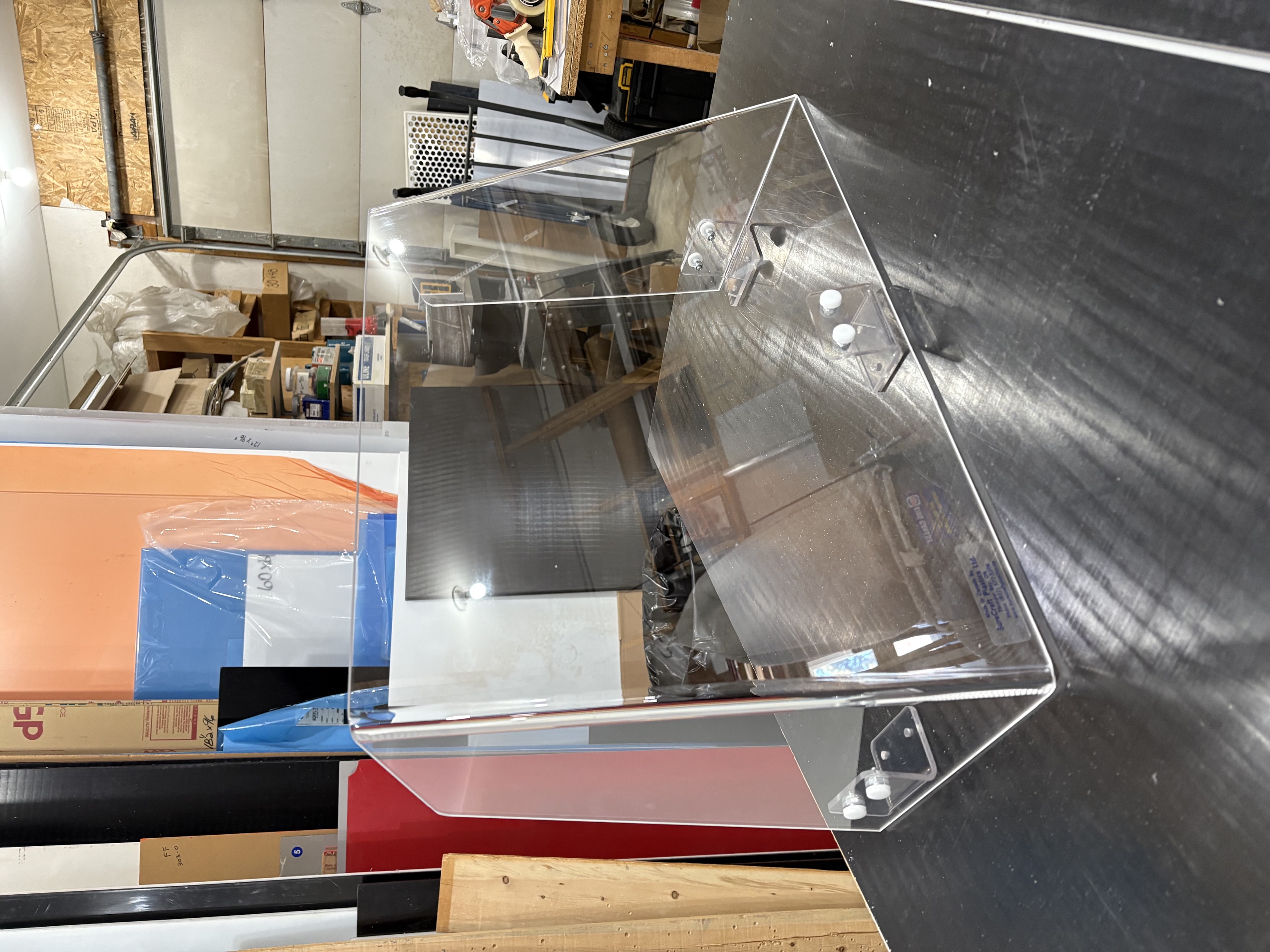 Clear custom-formed boat windshield in the Surecraft workshop