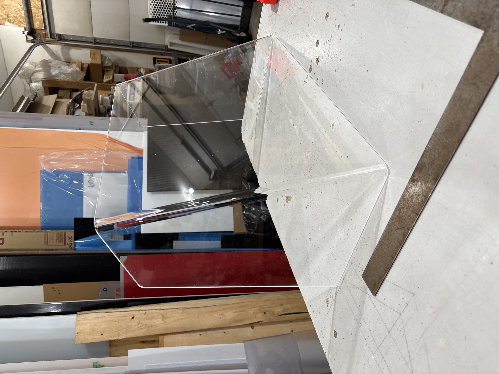 Clear angular replacement boat windshield in the fabrication shop